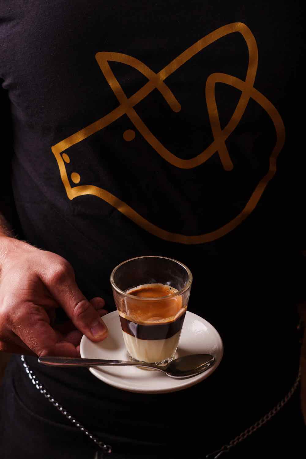 A Piggs coffee served in a cup and saucer